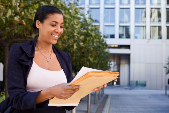 woman reading papers