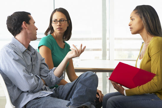 three people talking