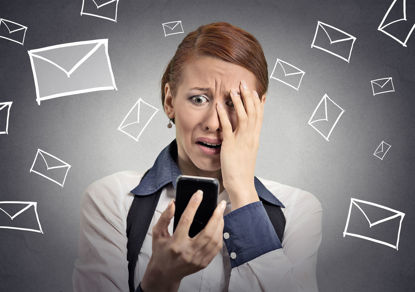 woman looking at cellphone with images of mail all around her