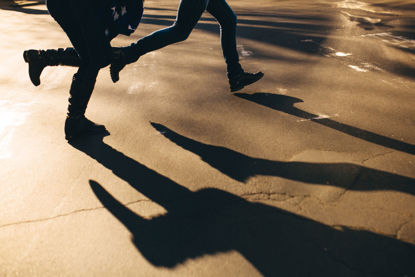 shadows of people running