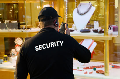 security guard on walkie talkie in jewelry store